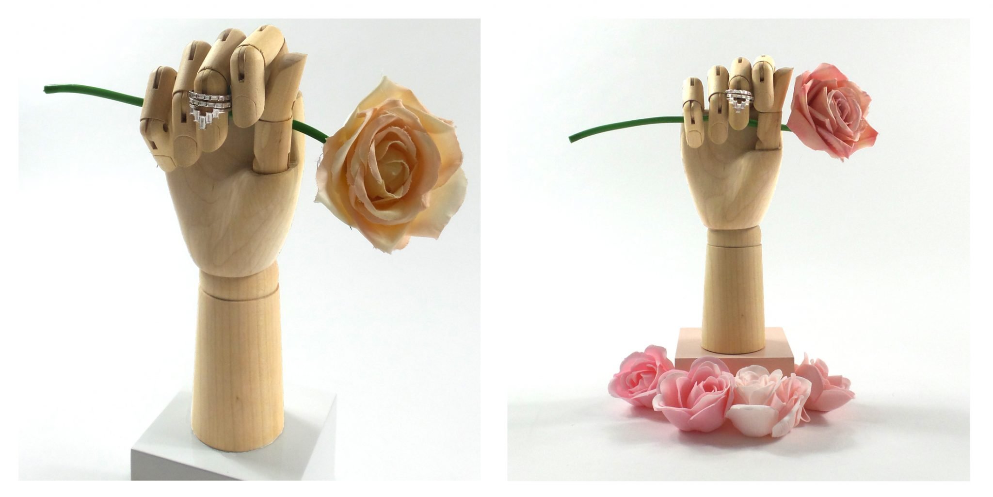 wooden display hand being used to create a mothers day visual merchandising display. This hand is used to display a selection of jewellery and fashion accessories such as necklaces rings and bracelets. TJDC