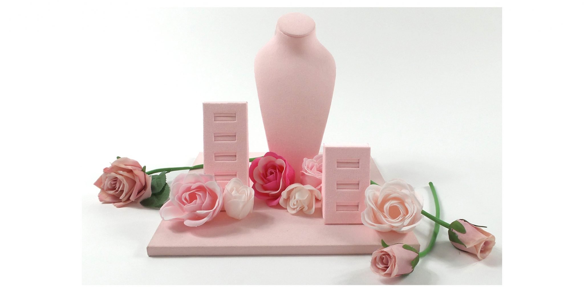 Blush/pastel pink jewellery display set featuring ring stands and necklace bust. this visual merchandising display was created as a mothers day display idea TJDC